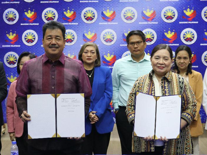 CHED Chair J. Prospero De Vera III and CEM President and CEO Dr. Grace H. Aguiling-Dalisay with signed MOA